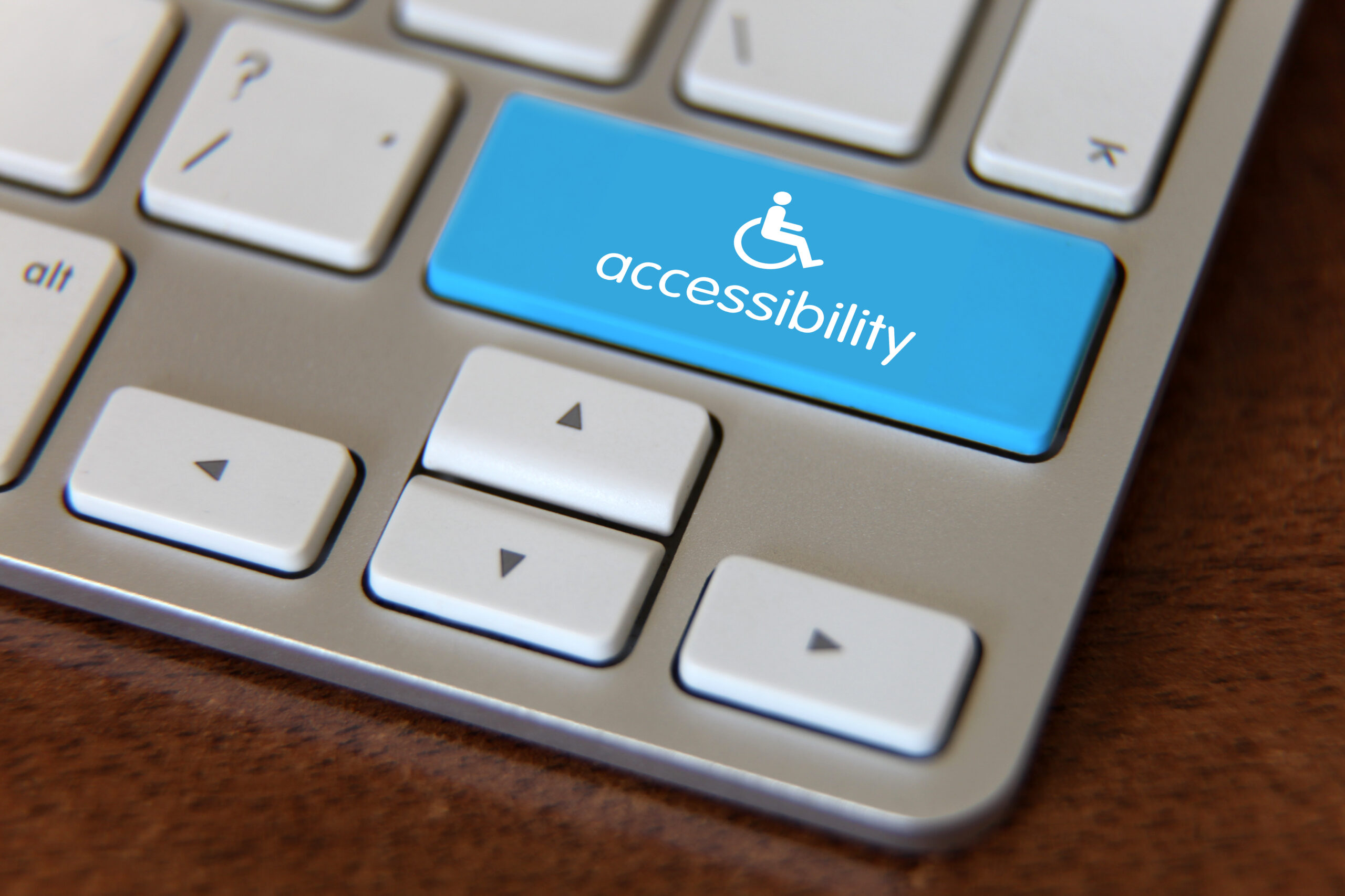 keyboard showing a blue accessibility key to symbolize website accessibility